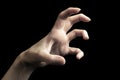 Scary hand gesture isolated on black Royalty Free Stock Photo